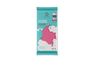 A teal wrapper, designed with an illustrated map of Colombia in pink. An arrow points to a location on the Western coast, where this origin farm is located.