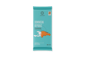 
            
                Load image into Gallery viewer, A teal wrapper, designed with an illustrated map of the Dominican Republic in orange. An arrow points to a location on the Eastern coast, where this origin farm is located.
            
        